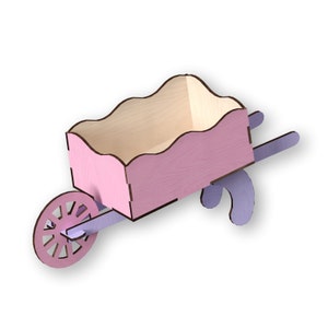 May include: A pink wooden toy wheelbarrow with a light wood interior and a purple handle. The wheelbarrow has a decorative wheel with a cutout design.