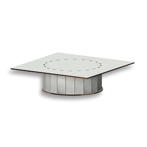 May include: White wooden square table with a round cutout in the center. The table has a whitewashed wood finish and a circular base.