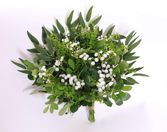 May include: A bouquet of white baby's breath flowers and green foliage.