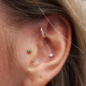 Bague pliable sans couture multipierre hélice avant en or massif 14 carats..18 g..7 mm..Magnifique !