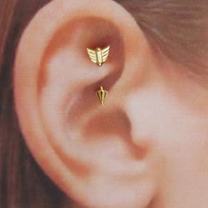 Piercing con forma de flecha y barra curva Golden Rook, 16 g, 8 mm (E07G)