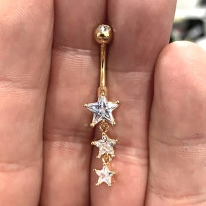 Gouden drievoudige ster-navelring..14G 7/16 (11 mm)