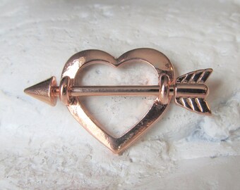 1.6mm Rose Gold Colored Cupids Heart Nipple Shield Ring - Sold as a Pair 14G 1.6mm Rose Gold Colored Cupids Heart Nipple Shield Ring - Sold as a Pair 14G