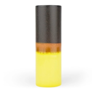 May include: A tall, cylindrical ceramic vase with a brown, orange, and yellow ombre glaze.