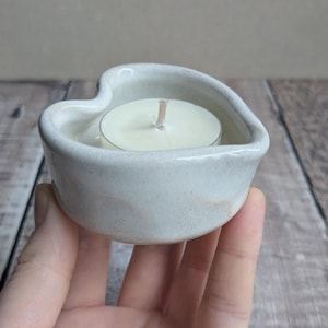 Ceramic heart shaped tealight with an off white glaze