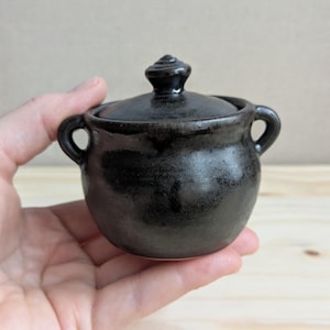 Small ceramic lidded cauldron pot with satin black glaze