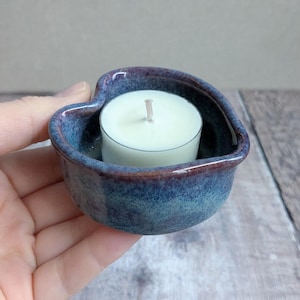 Ceramic heart shaped tealight with a blue glaze and a hint of purple