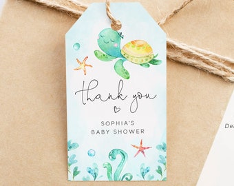 May include: A blue and green watercolor thank you tag with a cartoon turtle, starfish, and bubbles. The text reads "Thank you" with a heart and "Sophia's Baby Shower".