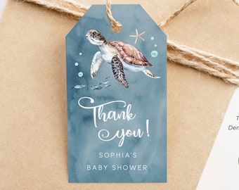 May include: Blue and white thank you tag with a watercolor illustration of a sea turtle, starfish, and bubbles. The text reads "Thank you! Sophia's Baby Shower".