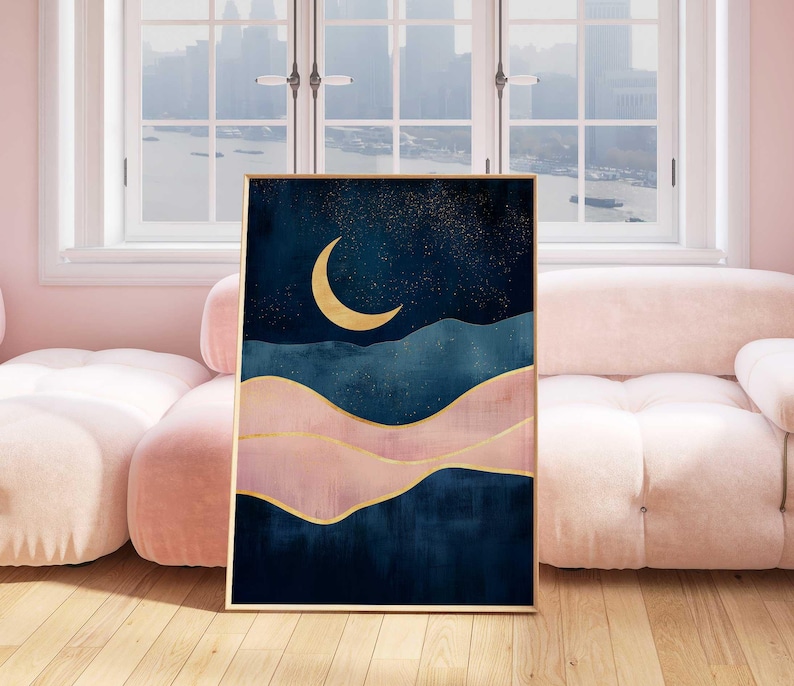 May include: Abstract art print featuring a crescent moon in gold against a dark blue background with pink and gold accents. The print depicts a stylized landscape with rolling hills and a starry sky.