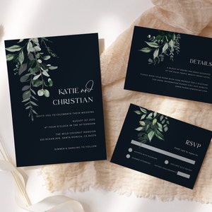 May include: Navy blue wedding invitation suite with botanical watercolor greenery. The invitation includes the names "Katie and Christian", event details, and venue information. The suite also includes RSVP and details cards.