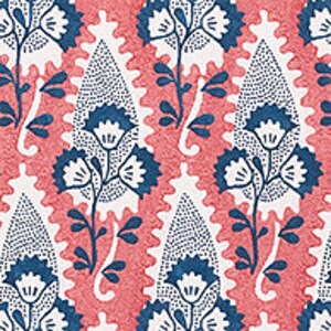 May include: A repeating pattern of blue and pink paisley shapes with white floral designs. The paisley shapes are outlined in blue and filled with a white dotted pattern. The floral designs are stylized and have white petals and blue stems.