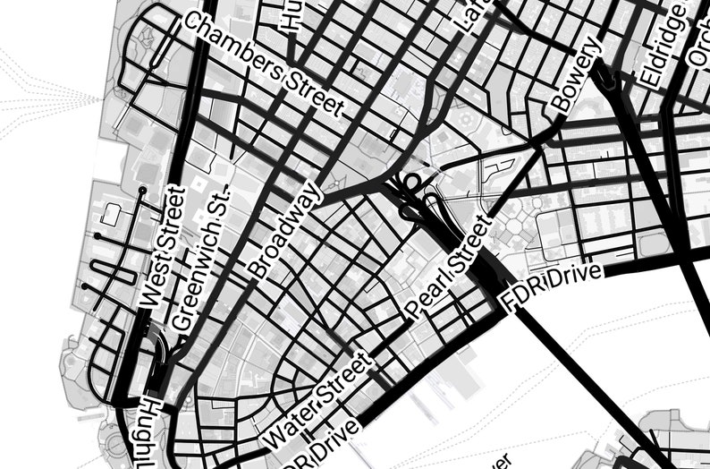 May include: A detailed black and white map of a city, featuring street names like Broadway, Chambers Street, and FDR Drive. The map shows a grid-like pattern of streets and buildings, with varying line thicknesses indicating road widths.