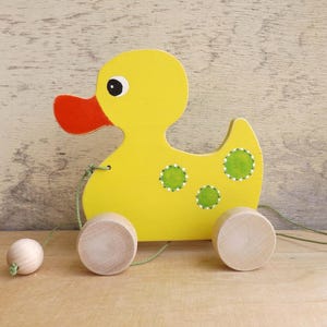 Wooden pull toy: Yellow Duck, hand cut custom animal on wheels, handpainted kid&#39;s name