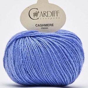 May include: A ball of light blue cashmere yarn with a label that reads "CARDIFF CASHMERE classic".