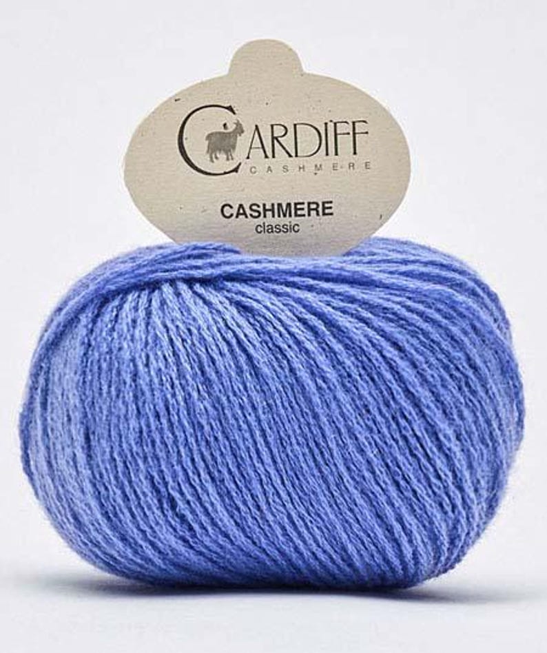 May include: A ball of light blue cashmere yarn with a label that reads "CARDIFF CASHMERE classic".