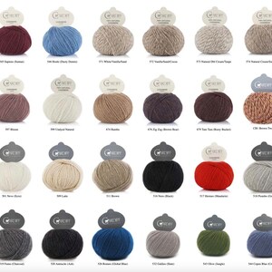 May include: A collection of colorful yarn balls, each labeled with a unique name and number. The yarn is 100% natural cashmere, with shades ranging from deep red to light blue, beige, and black. Ideal for knitting and crochet projects.