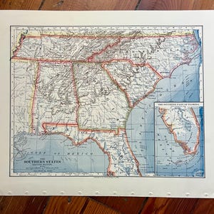 May include: A vintage map of the Southern States of the United States, showing the Eastern Section. The map is printed in blue, red, and yellow on a white background. The map includes the Gulf of Mexico and the Southern part of Florida.
