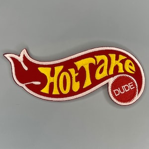 May include: Red and white embroidered patch with the text "Hot Take" in yellow lettering. A smaller red circle with the word "Dude" in white lettering is on the right side of the patch.