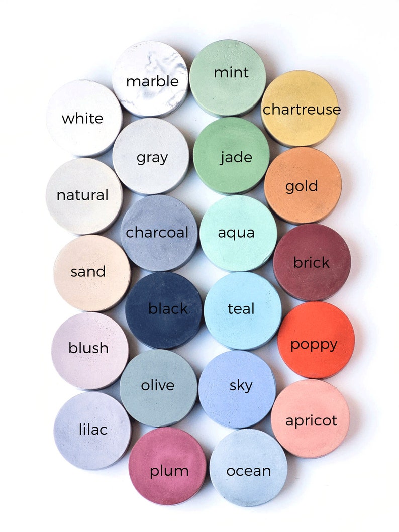 May include: A collection of 20 small round concrete coasters in various colors, including mint, marble, chartreuse, white, gray, jade, natural, gold, charcoal, aqua, brick, sand, blush, black, teal, poppy, olive, sky, apricot, lilac, plum, and ocean.