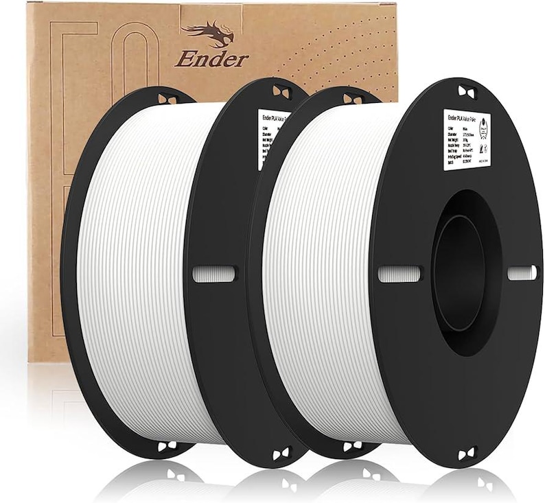 May include: Two spools of white filament for 3D printing. The spools are labeled "Ender PLA Filament".
