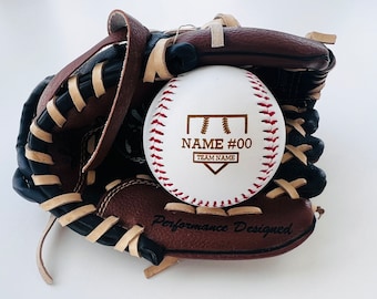 May include: A white baseball with red stitching and a brown leather baseball glove. The baseball has a gold design with the text "NAME #00 TEAM NAME".