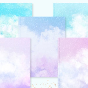 May include: A collection of five notebooks with watercolor cloud designs in shades of blue, purple, and pink. Each notebook features a different cloudscape, with a soft, dreamy aesthetic. The covers have a subtle, glittery effect.