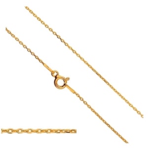 May include: A delicate gold-colored necklace with a small, round clasp. The chain is made of small, connected links. A close-up of the chain is shown at the bottom. The necklace is a simple, elegant piece of jewelry.