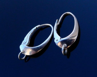 May include: A pair of polished silver leverback earrings. The earrings have a teardrop shape with a hinged lever closure. Each earring has a small loop at the bottom. The background is a dark blue.