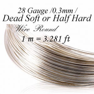 Può includere: Primo piano di una bobina di filo color argento. Il testo sull'immagine recita "28 Gauge / 0,3 mm / Dead Soft or Half Hard Wire Round 1 m = 3,281 ft."