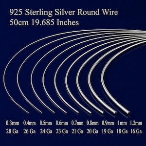 May include: A collection of 925 sterling silver round wire, with sizes ranging from 0.3mm to 1.2mm. The image includes the text "50cm 19.685 Inches" and gauge sizes from 28 Ga to 16 Ga. The wires are curved and displayed against a dark blue background.
