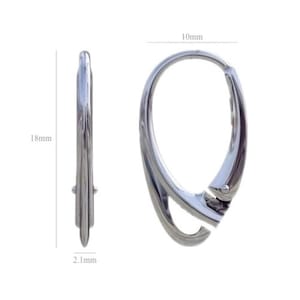 May include: A pair of silver-colored hoop earrings. The earrings are 18mm in height, 10mm in width, and 2.1mm thick. The design features a unique, curved shape with a hinged closure. The earrings are shown against a white background.