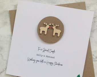 Personalised Christmas Card to a Special Couple Kissing Wooden Reindeers