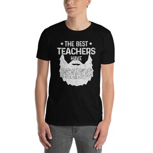 May include: Black t-shirt with a white graphic that says "The Best Teachers Have Beards" with a stylized beard image.
