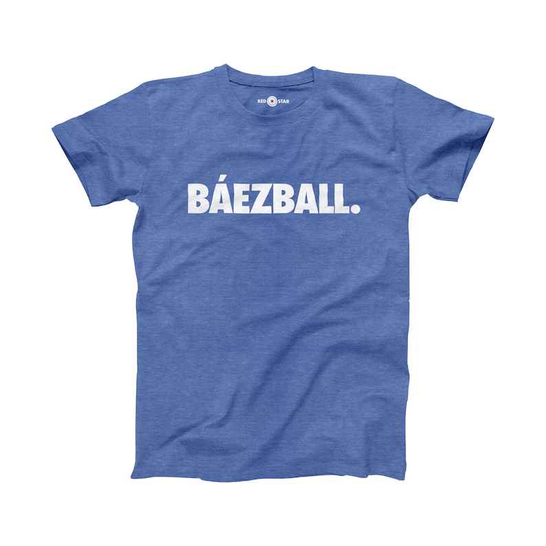 May include: A blue t-shirt with the text "B&Aacute;EZBALL." printed in white.