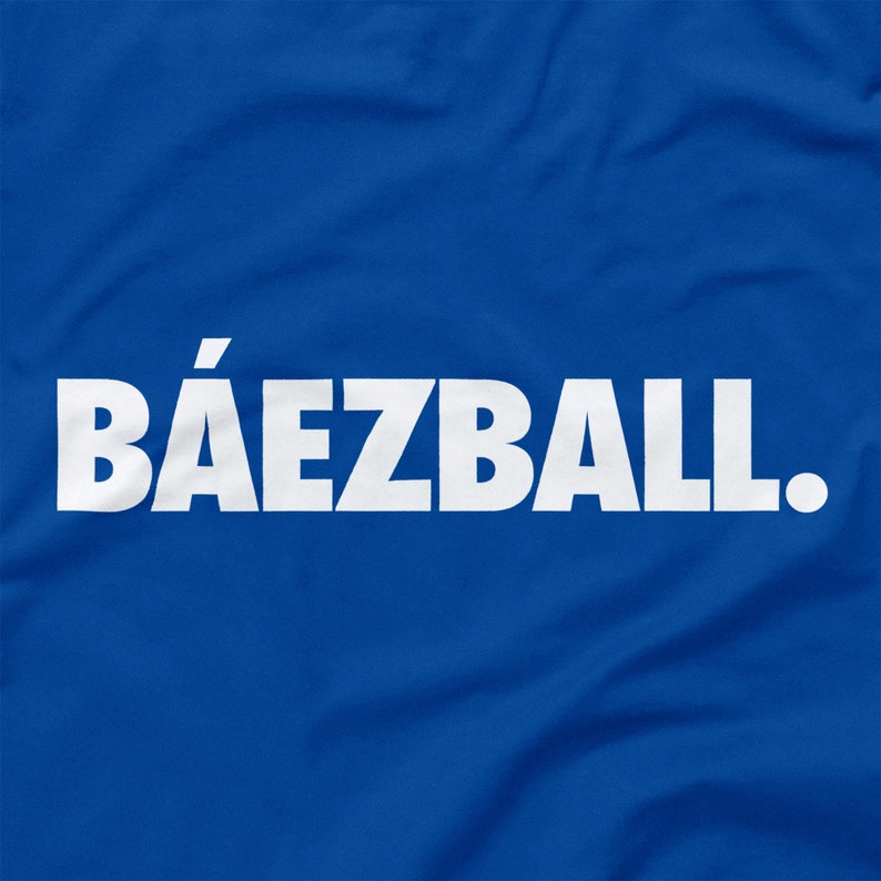 May include: A royal blue t-shirt with the white text "B&Aacute;EZBALL."