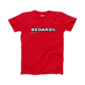May include: Red t-shirt with a white graphic of the word "BEDARDS" in a rainbow arc.