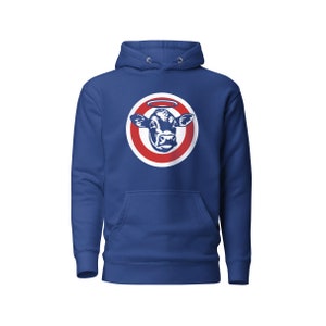 May include: A royal blue hoodie with a white circle and red ring around a black and white cow head with a halo.