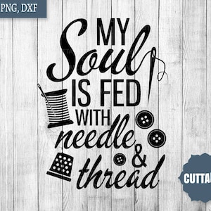 May include: Black and white graphic design with the text "My Soul is Fed with Needle & Thread". The design includes a spool of thread, a needle, and buttons.