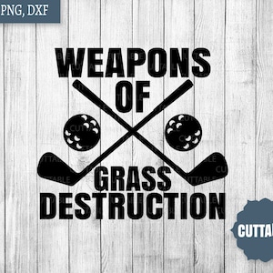 May include: Black and white graphic design with the text "Weapons of Grass Destruction" and two crossed golf clubs with golf balls.