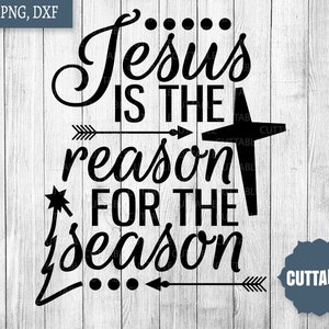 May include: Black and white graphic design with the text "Jesus is the reason for the season" with a star and arrows. The text is in a cursive font. The background is a wood grain pattern.