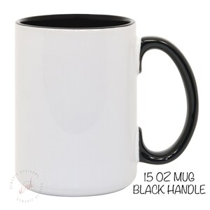 May include: A white 15 oz mug with a black interior and handle. The mug has the text "15 OZ MUG BLACK HANDLE" in a handwritten style font. The mug is a classic design for beverages.