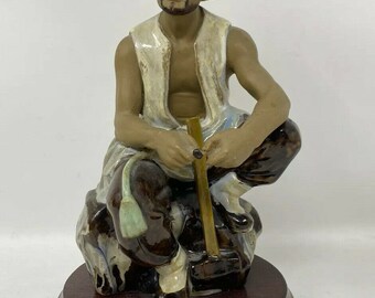 Vintage 8 in Mud Man Figure Man on a Rock Holding Hammer