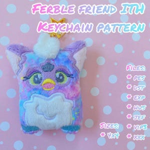 May include: A purple and blue fuzzy keychain with a white face and yellow eyes. The keychain is in the shape of a popular toy. The text "FERBLE FRIEND ITH KEYCHAIN PATTERN" is at the top of the image. The text "FILES: * PES *DST * EXP * HUS *JEF SIZES: * VIP3 *4x4*xxx" is at the right side of the image.