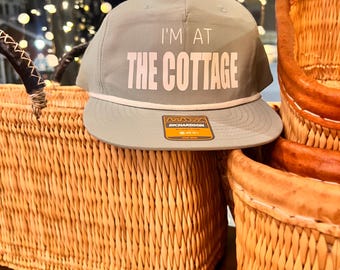 Heated Rivalry Camper hat. I'm at the cottage
