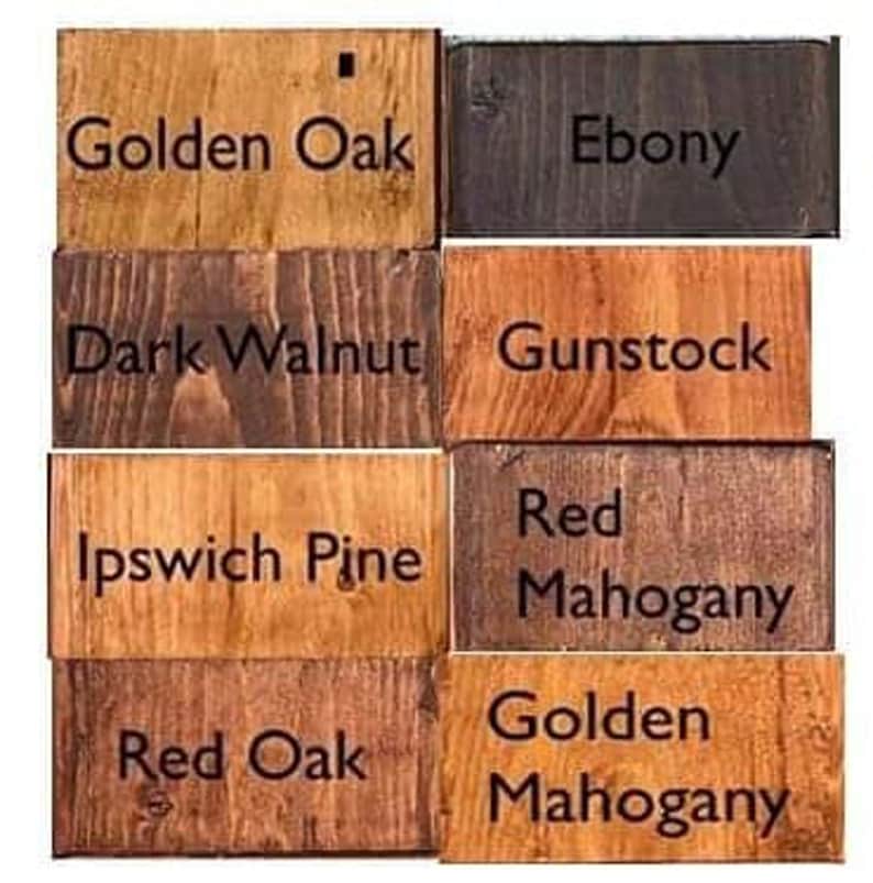 May include: Wood stain color samples in various shades of brown, red, and black. The samples are labeled with the following names: Golden Oak, Ebony, Dark Walnut, Gunstock, Ipswich Pine, Red Mahogany, Red Oak, and Golden Mahogany.