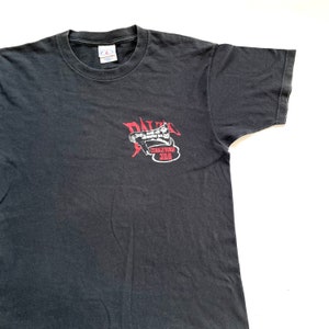 May include: Black t-shirt with a red graphic of a megaphone with the text "DALE'S 306 RPM LIVE MUSIC" and "TERRIBLYFUNK 306".