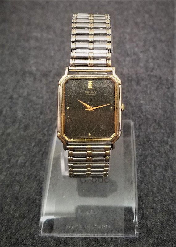 seiko gold watch black face