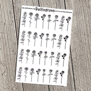 Puede incluir: Una hoja de pegatinas con ilustraciones de rosas en blanco y negro. Cada rosa tiene una flor y un tallo detallados con hojas. Las pegatinas están sobre un fondo blanco, con la dirección web "www.dallingtons.com" visible en la parte superior.