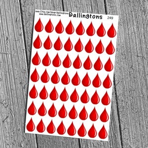 May include: A sheet of stickers featuring numerous red teardrop shapes. The stickers are arranged in rows and columns on a white background. The sheet is labeled with the text "Dallington's" and the number "249".